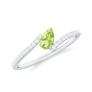 Tilted Pear Cut Peridot Solitaire Bypass Ring with Diamond